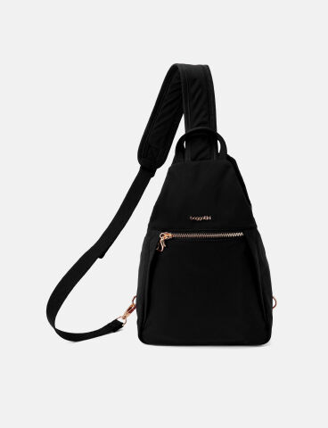 Cream sling bag with gold-tone hardware, multiple zippered compartments, and a compact hands-free design.