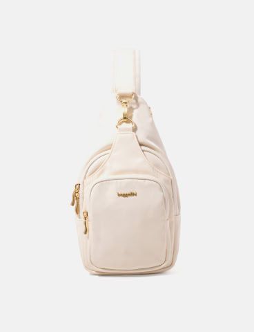 A blue quilted sling bag with a single shoulder strap and a front zipper pocket, displayed against a plain white background.