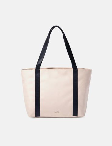 Cream tote bag with contrasting navy shoulder straps and a spacious open-top design.
