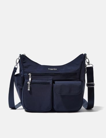Navy shoulder bag featuring multiple exterior pockets, zippered storage compartments, and an adjustable crossbody strap.