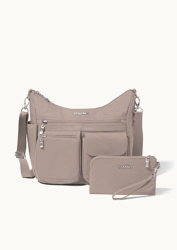 Taupe shoulder bag with multiple front pockets and silver-tone hardware displayed alongside a matching wristlet pouch on a neutral background.