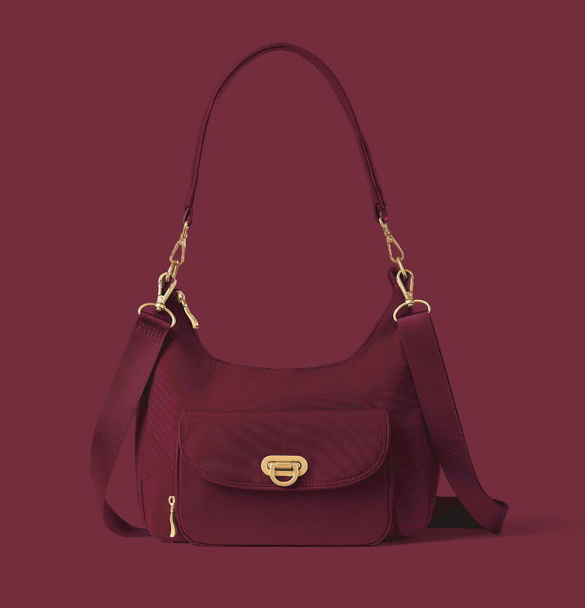 Burgundy Baggallini shoulder bag with removable straps, front pocket and gold hardware.
