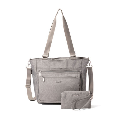 baggallini travel tote bag All Set 3 in 1 Backpack Crafted to be Clean Unlined tote bag folds up into 9h x 12w front pocket for easy storage Tote bag bottom section expands 4.75 10 Shoulder drop Luggage sleeve Interior organization and multifunctional pockets Exterior dimensions Baggallini Carry-All Travel Tote MCT207B0018